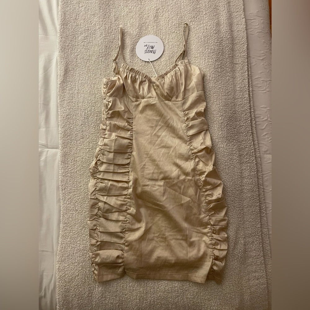 Champagne ruched mini dress.